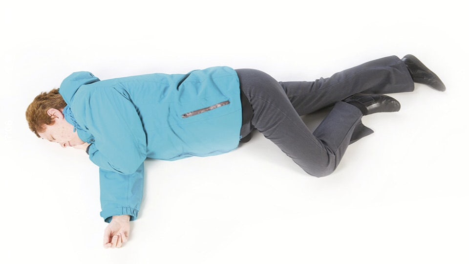 If the casualty is unconscious and breathing, place them in the recovery position until medical help arrives